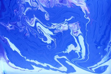 Abstract blue marble background. The lines and waves of acrylic paint create an interesting structure. Background for web design, fabric, design, laptop case.