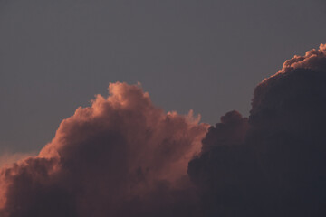 Fluffy clouds during sunrise with copyspace, dreamy look