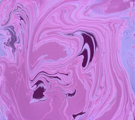 Abstract pink marble background. The lines and waves of acrylic paint create an interesting structure. Background for web design, fabric, design, laptop case.