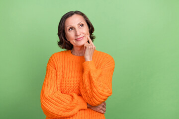Photo of attractive mature woman finger touch chin wondered ponder thoughts look empty space...