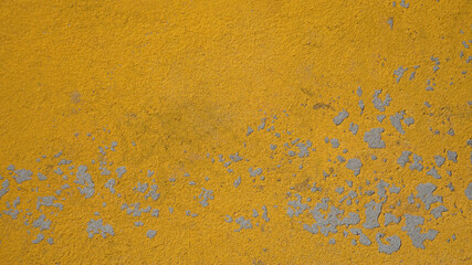 background texture stone wall painted with yellow paint, old scuffed surface vintage