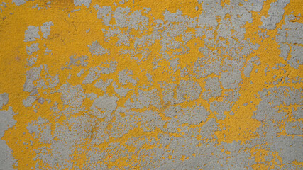 background texture stone wall painted with yellow paint, old scuffed surface vintage