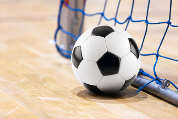 Sport futsal background. Football futsal ball goal and floor. Indoor soccer sports hall.  Indoor Soccer Winter League