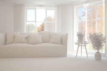 Stylish room in white color with sofa and autumn landscape in window. Scandinavian interior design. 3D illustration