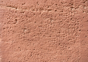 Red sandstone brick. Sandstone texture with little holes.