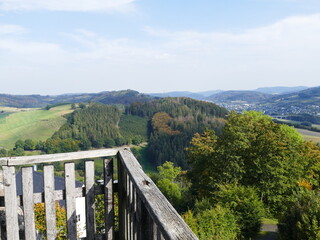 Fototapeta premium View from the observation platform of the Eversberg castle ruins on the autumn forests of the Sauerland, North Rhine-Westphalia, Germany