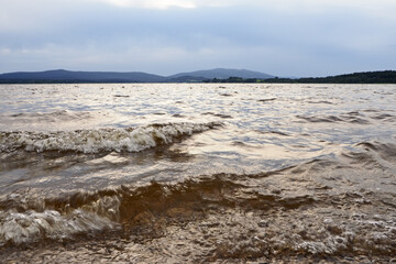 Stormy water level of lake Lipno in the mountains Sumava, Czech Republic