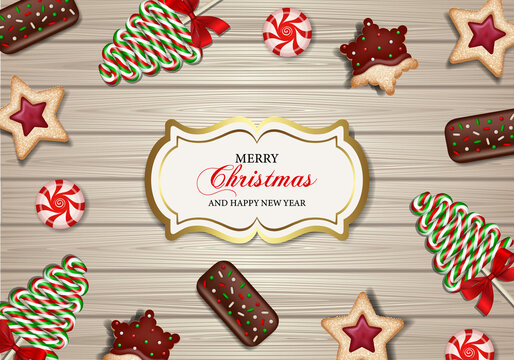 Merry christmas poster with sweets on wooden background