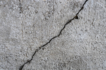 Crack in old concrete wall, surface as background