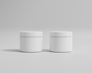 A round white plastic cream bottle