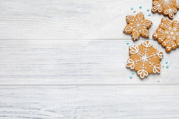 Tasty Christmas cookies on white wooden table, flat lay. Space for text