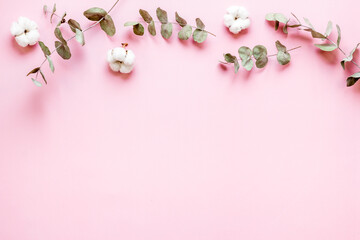 Eucalyptus leaves and cotton flowers pattern, flat lay