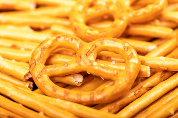 Crispy bread straws with salt, close-up, selective focus, top view.