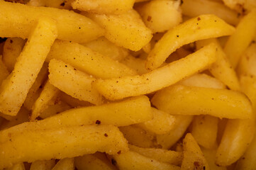 French fries on a plate, close-up, selective focus.