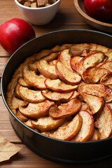 Delicious apple pie on wooden table, closeup