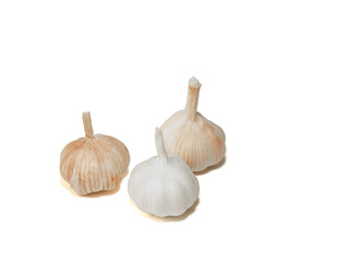 Garlic on a white background. Three garlic