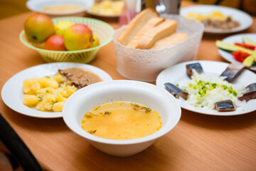 Traditional food in Russia. Soup, herring and potatoes. Russian national food. 