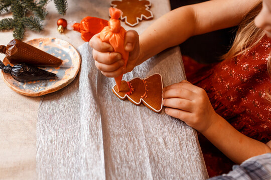 children decorate gingerbread homemade cookies by kids.  master-class. christmas activity