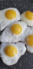 Fresh quail eggs are fried in a pan. Healthy breakfast of scrambled eggs.