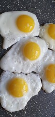 Fresh quail eggs are fried in a pan. Healthy breakfast of scrambled eggs.