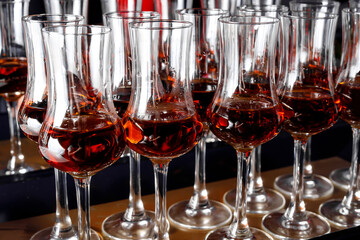 A row of cognac glasses.