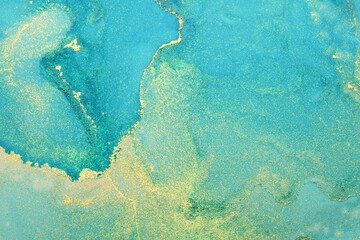 Art Abstract painting blots background. Alcohol ink blue and gold colors. Marble texture.