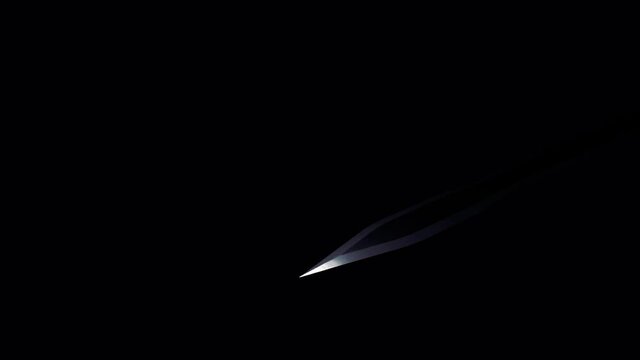 A medieval sword of silver color flying against black backdrop. Design. Game of light and shadow, concept of war or battle, sharp weapon in the dark, monochrome.