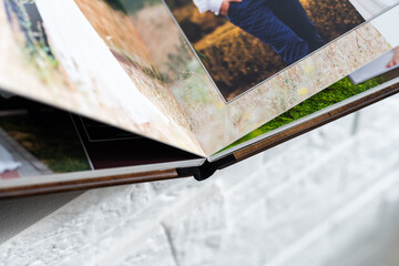 photo book with wooden cover. unfolded photobook. sample photobook.