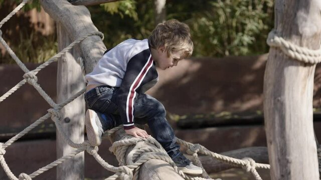 Little autistic boy on playground