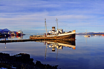 old boat and beached in ushuaia, saint christopher