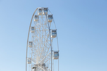 a Ferris wheel against the blue sky