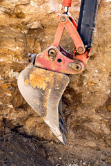 Backhoe ditch digging bucket detail close-up