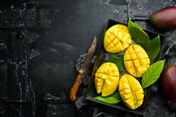 Sliced fresh juicy mango. Top view. Tropical fruits.