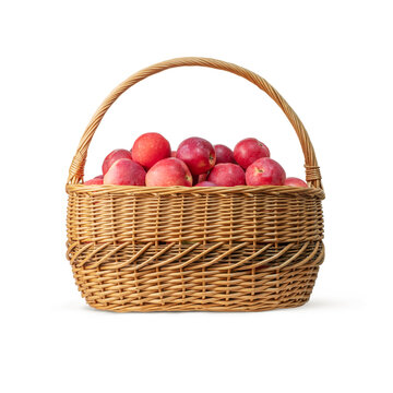 Isolated wicker basket with red ripe apples on white background 