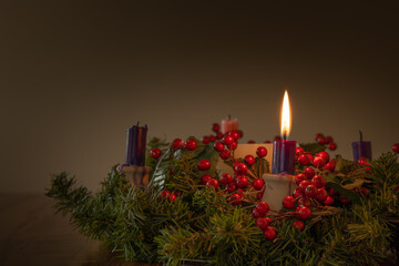 Advent wreath with one candle lit with copy space
