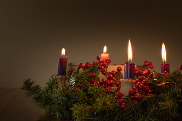 Advent wreath with four candles lit with copy space 