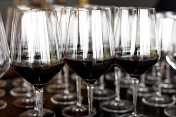 Glasses with red wine at an event.