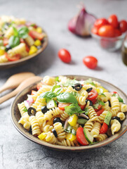 A bowl with traditional Italian pasta salad	