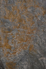 Gray stone background. Iron impurities. Vertical image. 
