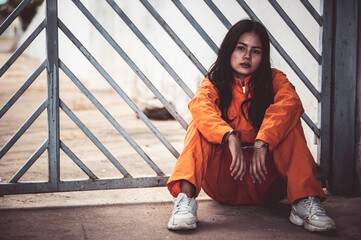 Portrait of women desperate to catch the iron prison,prisoner concept,thailand people,Hope to be...