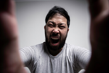 Asian handsome man angry on white background,Portrait of young Stress male concept