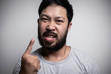 Obraz premium Asian handsome man angry on white background,Portrait of young Stress male concept