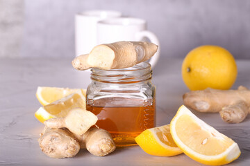 honey with lemon and ginger is on the table