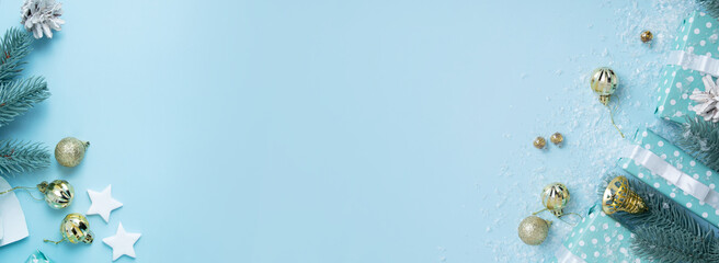 Gift boxes and Christmas decor with snow. Festive winter Xmas banner background with copy space