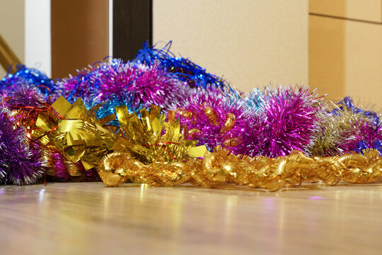 A Pile Of Multicolored Tinsel Lies On The Floor