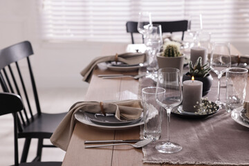Festive table setting with beautiful tableware and decor indoors