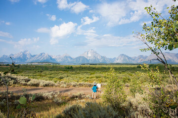 Artist live painting in the Grand Tetons National Park, Wyoming, USA