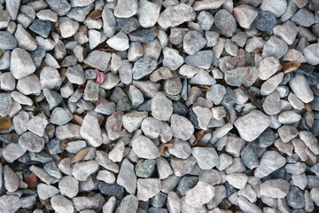 Full frame close-up view of an area of gravel stones in shades of gray