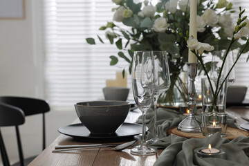 Festive table setting with beautiful tableware and decor indoors