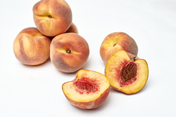Naklejka na ściany i meble fresh ripe peaches on white background